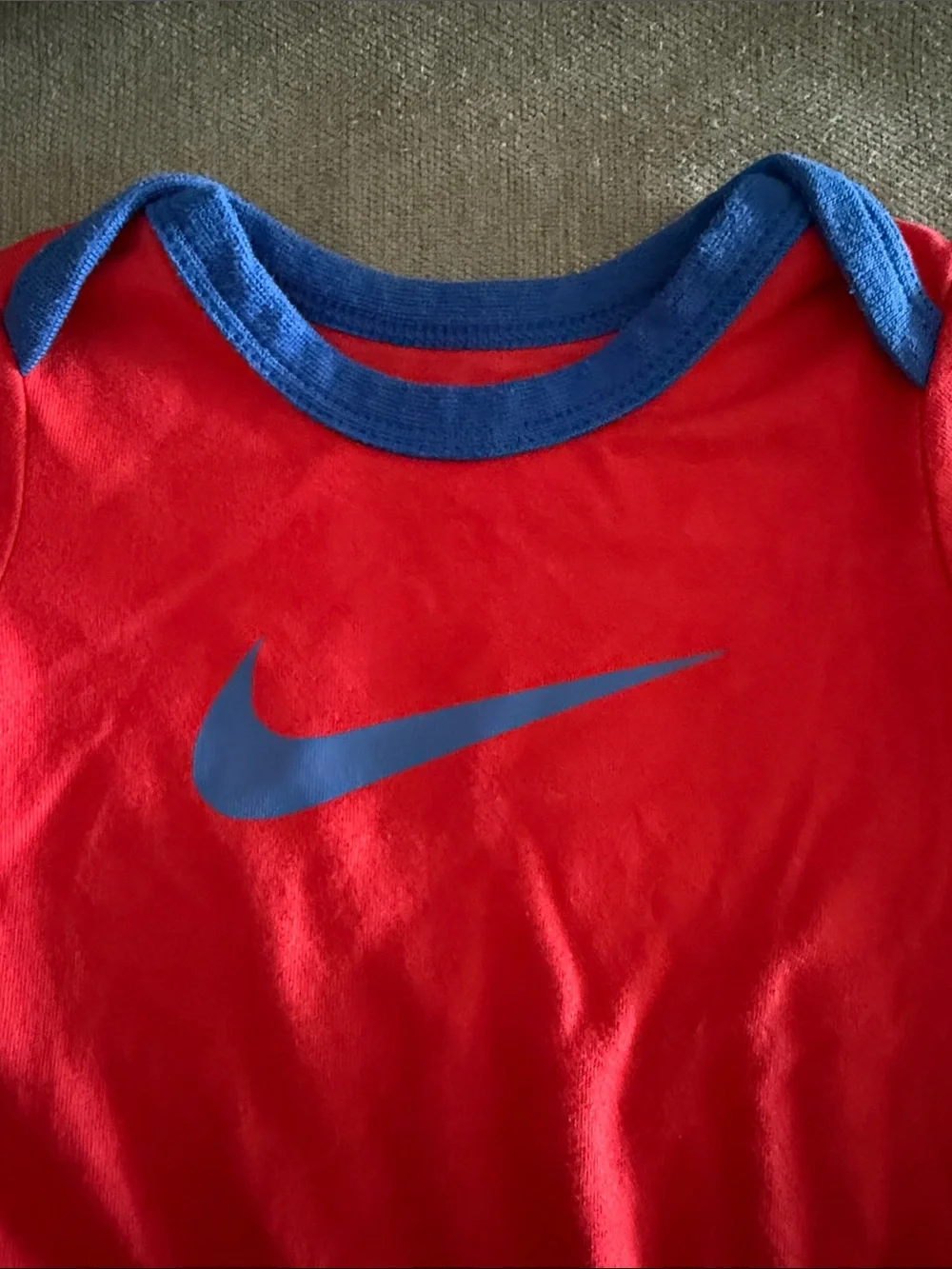 Nike Red Baby Bodysuit with Blue Trim and Swoosh